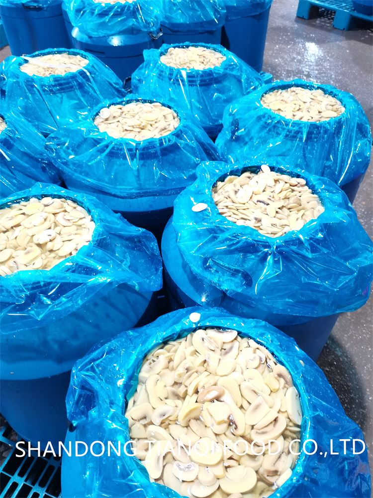 Best sliced white mushroom in salted water in drums